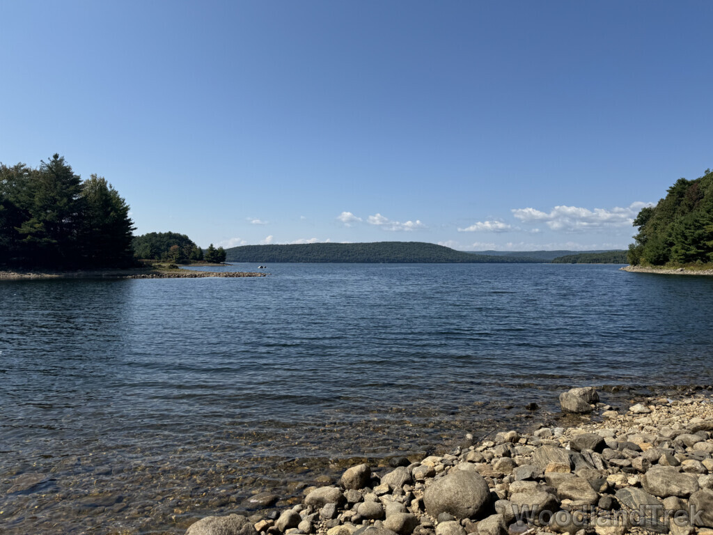 Clear water with gentle waves along a rocky coastline of Quabbin Reservoir