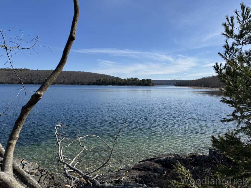 View from the shore of Quabbin Reservoir over clear blue water with gentle texture