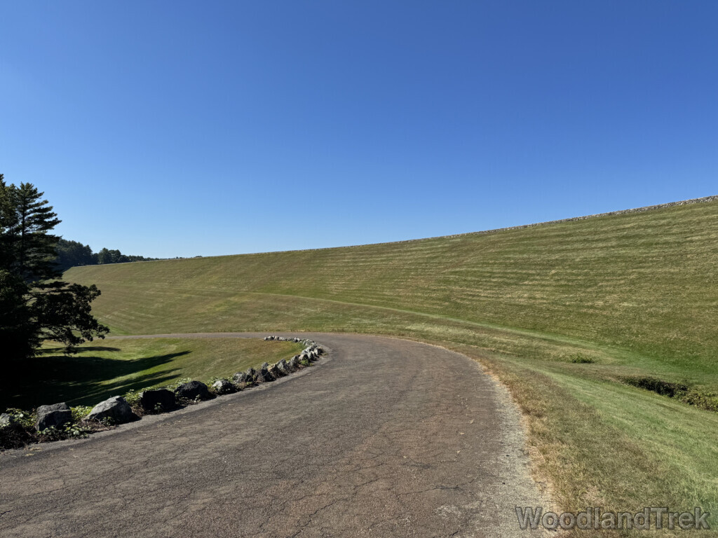 View of Windsor Dam from lower access road under clear blue sky