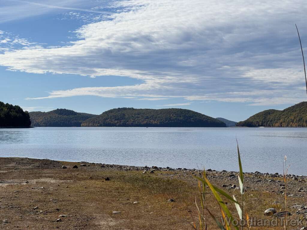 View of Mount Zion from the end of Rabbit Run Rail Bed at Quabbin Reservoir with calm, reflective water