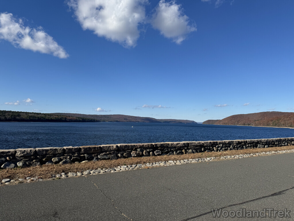Quabbin Reservoir viewed from Windsor Dam with calm water and stone wall lining the dam